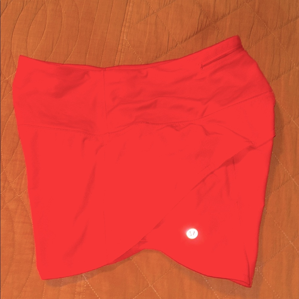 Coral orange shorts with liner size 4